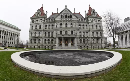 The New York state Capitol in Albany, N.Y., is pictured on Dec. 14, 2020. New York's minimum-wage workers had more than just the new year to celebrate Monday, Jan. 1, 2024, with a pay bump kicking in as the clock ticked over to 2024. In the first of a series of annual increases slated for the Empire State, the minimum wage increased to $16 in New York City and some of its suburbs, up from $15. In the rest of the state, the new minimum wage is $15, up from $14.20. (AP Photo/Hans Pennink, File)