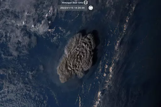 This satellite image taken by Himawari-8, a Japanese weather satellite operated by Japan Meteorological Agency and released by National Institute of Information and Communications Technology (NICT), shows an undersea volcano eruption at the Pacific nation of Tonga Saturday, Jan. 15, 2022. (NICT via AP)