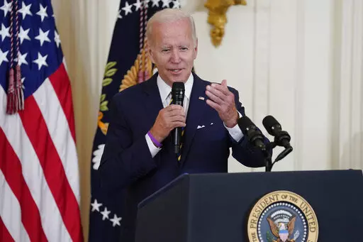 President Joe Biden speaks during an event in the East Room of the White House, Aug. 10, 2022, in Washington. Biden will host a White House summit next month aimed at combatting a spate of hate-fueled violence in the U.S., as he works to deliver on his campaign pledge to "heal the soul of the nation." (AP Photo/Evan Vucci, File)