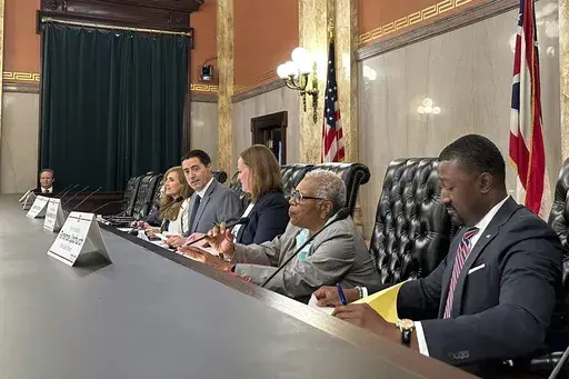 Members of the Ohio Ballot Board convene at the Ohio Statehouse in Columbus, Ohio, Friday, Aug. 16, 2024, to consider language for a fall redistricting amendment. (AP Photo/Julie Carr Smyth)