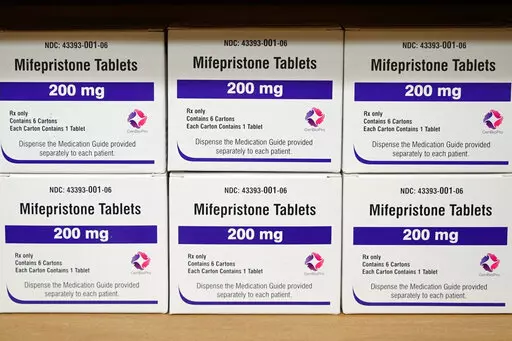 Boxes of the drug mifepristone sit on a shelf at the West Alabama Women's Center in Tuscaloosa, Ala., on March 16, 2022. On Tuesday, Jan. 3, 2023, the Food and Drug Administration finalized a rule change that allows women seeking abortion pills to get them through the mail, replacing a long-standing requirement that they pick up the medicine in person. (AP Photo/Allen G. Breed, File)
