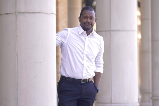 Texas Christian University assistant professor of literature Brandon Manning posses for a photo at TCU campus in Fort Worth, Texas, Tuesday, Feb. 15, 2022. Manning was born in the U.S. South and had been itching to return there, but Manning didn't want to go back to his native Atlanta because of the traffic, cost of housing and sprawl. He made a list of smaller cities in the South he would consider, and when the opportunity came for Manning to take a job teaching in Texas at TCU he jumped. (AP P