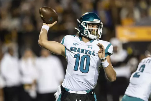 Coastal Carolina quarterback Grayson McCall (10) throws a pass during the first half of the team's NCAA college football game against Appalachian State on Oct. 20, 2021, in Boone, N.C. Coastal Carolina begins their season at UCLA on Sept. 2, 2023. (AP Photo/Matt Kelley, File)