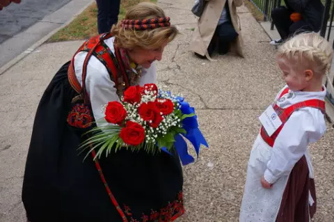 Eline Gro Knatterud, 4, greets Queen Sonja of Norway as she arrives to Den Norske Lutherske Mindekirke, the Norwegian Lutheran Memorial Church in Minneapolis, Sunday Oct. 16, 2022. (AP Photo/Giovanna Dell'Orto)