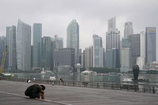 The central business district is shrouded by haze in Singapore, on Sept. 23, 2019. Singapore conducted its first execution of a woman in 19 years on Friday, July 28, 2023, and its second hanging this week for drug trafficking despite calls for the city-state to cease capital punishment for drug-related crimes. (AP Photo/Vincent Thian, File)