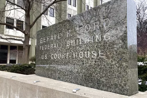 The exterior of the federal courthouse is shown March 9, 2022, in Grand Rapids, Mich. The trial of four men charged with planning to kidnap Michigan Gov. Gretchen Whitmer is taking place inside. (AP Photo/Mike Householder)
