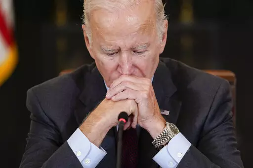 President Joe Biden listens to doctors speak during a meeting of the reproductive rights task force in the State Dining Room of the White House in Washington, Tuesday, Oct. 4, 2022. (AP Photo/Susan Walsh)