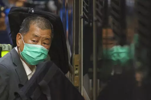 Democracy advocate Jimmy Lai leaves Hong Kong's Court of Final Appeal where the government is arguing against allowing him bail in Hong Kong, Feb. 1, 2021. Lai broke into the media industry about 30 years ago armed with the belief that delivering information equates with delivering freedom. Lai now is accused of endangering national security with his now-defunct pro-democracy newspaper Apple Daily. (AP Photo/Vincent Yu, File)