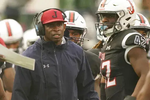 Jackson State head coach Deion Sanders glares at his players as they exit the field during the second half of an NCAA college football game against Southern University in Jackson, Miss., Saturday, Oct. 29, 2022. Jackson State won 35-0. (AP Photo/Rogelio V. Solis)
