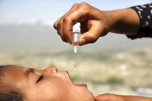 An Afghan health worker uses an oral polio vaccine on a child as part of a campaign to eliminate polio, on the outskirts of Kabul, Afghanistan, April 18, 2017. For years, global health officials have used billions of drops of an oral vaccine in a remarkably effective campaign aimed at wiping out polio in its last remaining strongholds — typically, poor, politically unstable corners of the world. Now, in a surprising twist in the decades-long effort to eradicate the virus, authorities in Jerusa