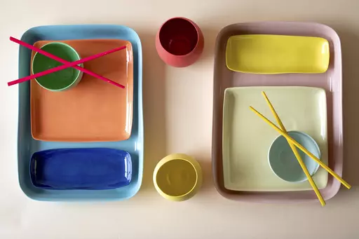 This image provided by Mud Australia shows dining plates. Mud Australia has matte-finish ceramic pieces in soft hues like pistachio, duck egg, mist, and blossom, that would make a dreamy set to dine on. Many chefs are using creative dishware designed with irregular shapes and unusual colors to help create a mood. (Becca Crawford/Mud Australia via AP).