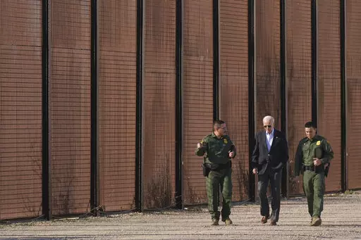 President Joe Biden walks with U.S. Border Patrol agents along a stretch of the U.S.-Mexico border in El Paso Texas, Sunday, Jan. 8, 2023. A new poll by The Associated Press-NORC Center for Public Affairs Research shows some support for changing the number of immigrants and asylum-seekers allowed into the country. About 4 in 10 U.S. adults say the level of immigration and asylum-seekers should be lowered, while about 2 in 10 say they should be higher, according to the poll. About a third want th