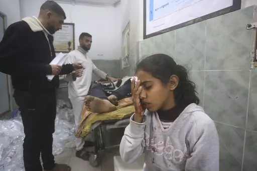 Palestinians wounded in Israeli bombardment receive treatment in a hospital t in Rafah, Gaza Strip, Monday, Feb. 5, 2024. (AP Photo/Hatem Ali)