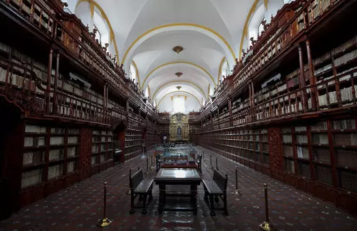 The interior of Palafoxiana library in Puebla, Mexico, Tuesday, Sept. 13, 2022. It is the oldest public library in the Americas, according to UNESCO. (AP Photo/Pablo Spencer)