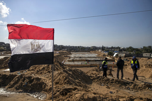 Laborers work on concrete slab foundations for one of three Egyptian-funded housing complexes in the Gaza Strip, in the town of Beit Lahiya, northern Gaza, Tuesday, Jan. 25, 2022. After years of working behind the scenes as a mediator, Egypt is taking on a much larger and more public role in Gaza. In the months since it brokered a Gaza cease-fire last May, Egypt has sent crews to clear rubbled and promised to build vast new apartment complexes, and billboards of its president Abdel-Fattah el-Sis