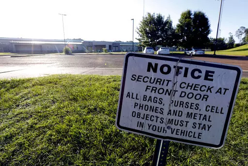 A security notice is posted outside the Hinds County Detention Center in Raymond, Miss., on June 12, 2015. A federal judge has issued a civil contempt order over conditions at the detention center.  U.S. District Judge Carlton Reeves wrote Friday, Feb. 4, 2022, that Hinds County officials have failed to fix problems in the jail that has experienced violence and lax security.  (AP Photo/Rogelio V. Solis, File)