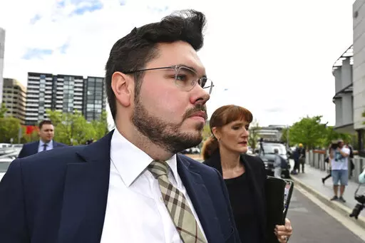 Former Liberal Party staff member Bruce Lehrmann arrives at the Australian Capital Territory Supreme Court in Canberra, Thursday, Oct. 27, 2022. A judge on Thursday discharged a jury in the high-profile trial of Lehrmann, a former government advisor, charged with raping a colleague in the Australian Parliament House because a juror had brought a research paper on sexual assaults into the jury room. (Mick Tsikas/AAP Image via AP)