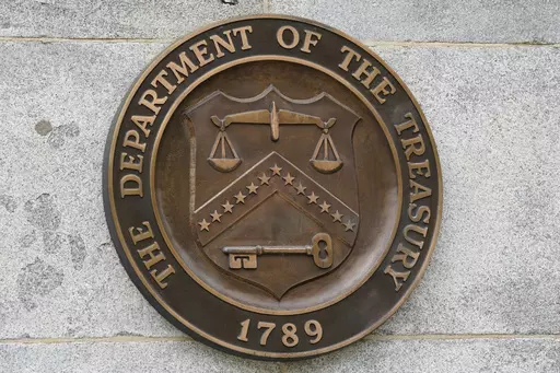 The Department of the Treasury's seal outside the Treasury Department building in Washington on May 4, 2021. The United States has slapped more sanctions on people and firms associated with Iran and with what it calls an illicit banking network used to conceal transactions. The U.S. said Thursday it placed the penalties on 39 firms linked to a shadow banking system that helped to muddy financial activity between sanctioned Iranian firms and foreign buyers, namely for petrochemicals. (AP Photo/Pa