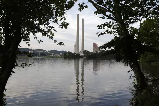 In this Aug. 7, 2019, photo, the Kingston Fossil Plant stands near a waterway in Kingston, Tenn. The nation’s largest public utility is moving ahead with a plan for a new natural gas plant in Tennessee despite warnings that its environmental review of the project doesn’t comply with federal law. The Environmental Protection Agency asked the Tennessee Valley Authority in a March 25, 2024 letter to redo several aspects of its environmental impact statement for converting the coal-burning Kings