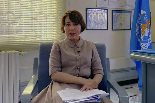 Dr. Akjemal Magtymova, the World Health Organization's representative in Syria, speaks during an interview at her office in Damascus, Syria, Tuesday, Feb. 2, 2021. Staffers at the WHO’s Syrian office have alleged that their boss mismanaged millions of dollars, plied government officials with gifts -- including computers, gold coins and cars -- and acted frivolously as COVID-19 swept the country. (AP Photo)