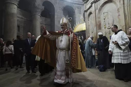 Latin Patriarch of Jerusalem Pierbattista Pizzaballa leads the Easter Sunday Mass at the Church of the Holy Sepulcher, where many Christians believe Jesus was crucified, buried and rose from the dead, in the Old City of Jerusalem, Sunday, April 9, 2023. Since the rise of Israel's most right-wing government in history, church leaders say the 2,000-year-old Christian community in Jerusalem has come under increasing attack, with an uptick in harassment of clergy and vandalism of religious propertie