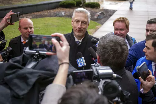 Michael Hills, the defense attorney representing Brandon Caserta, speaks to a scrum of reporters after Casterta was found not guilty of conspiring to kidnap and weapons charges outside the Gerald R. Ford Federal Building and Courthouse in Grand Rapids, Mich., Friday, April 8, 2022. Jurors have acquitted two defendants, Daniel Harris and Caserta, of all charges in a plot to kidnap Michigan Gov. Gretchen Whitmer but couldn't agree on a verdict for two others. (Daniel Shular/MLive.com/The Grand Rap