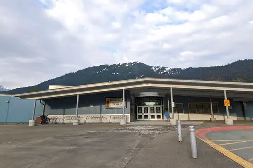 The Glacier Valley Elementary School is seen in Juneau, Alaska, on Tuesday, June 14, 2022. A dozen students and two adults were served floor sealant instead of milk at the school after containers were apparently mixed up, the superintendent said Wednesday. Several children complained of burning sensations in their mouth and throats, and at least one child was treated at the local hospital after the Tuesday morning mix-up, Superintendent Bridget Weiss said. (Ben Hohenstatt/The Juneau Empire via A