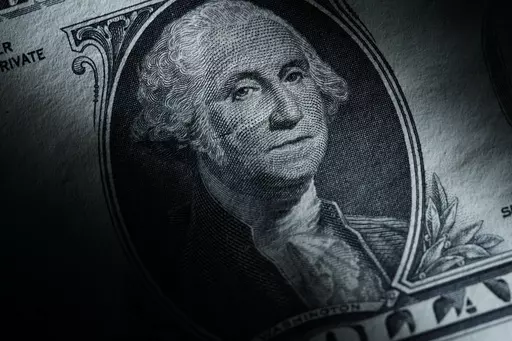 The likeness of George Washington is seen on a U.S. one dollar bill, Monday, March 13, 2023, in Marple Township, Pa. After years of paying low rates for savers, banks are finally offering better interest on deposits. Moving your savings around by opening a new account and closing an old one can seem like a hassle, but it's a use of time that can pay off. (AP Photo/Matt Slocum)