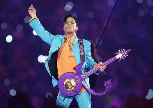 In this Feb. 4, 2007, file photo, Prince performs during the halftime show at the Super Bowl XLI football game in Miami. The six-year legal battle over pop superstar Prince’s estate has ended, meaning the process of distributing the artist's wealth could begin in February 2022. (AP Photo/Chris O'Meara, File)