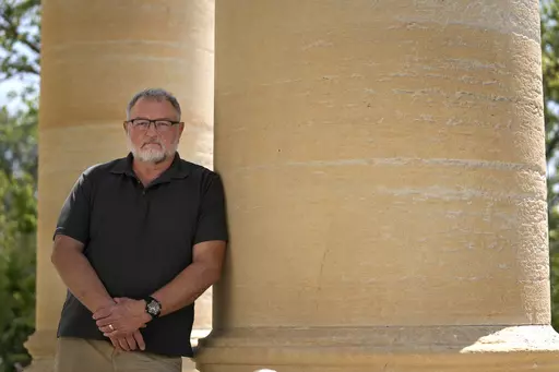 Macoupin County Republican Central Committee Chairman Tom Stoecker poses for a photo outside the Macoupin County Courthouse Tuesday, May 23, 2023, in Carlinville, Ill. Carlinville is located in one of Illinois' Congressional districts that flipped from Republican to Democrat as a result of gerrymandering. (AP Photo/Jeff Roberson)