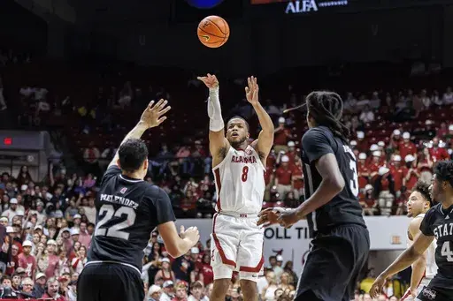 Alabama guard Chris Youngblood (8) shoots a 3-point shot against Mississippi State during the second half of an NCAA college basketball game, Tuesday, Feb. 25, 2025, in Tuscaloosa, Ala. (AP Photo/Vasha Hunt)