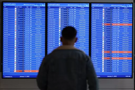 A traveler looks at a flight board with delays and cancellations at Ronald Reagan Washington National Airport in Arlington, Va., Wednesday, Jan. 11, 2023. Congressional investigators said in a report Friday, April 28, 2023, that an increase in flight cancellations as travel recovered from the pandemic was due mostly to factors that airlines controlled, including cancellations for maintenance issues or lack of a crew. (AP Photo/Patrick Semansky, File)