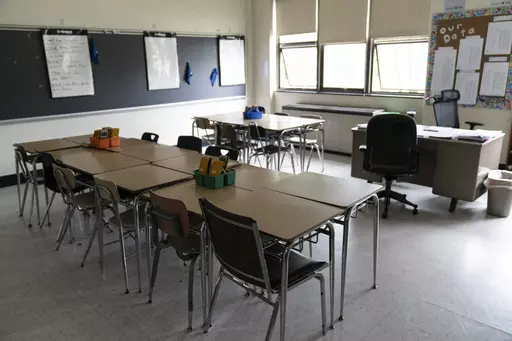 Desks fill a classroom in a high school in Pennsylvania on Wednesday, May 3, 2023. Gaps between how minority students perform academically in comparison to their white peers have long been an issue across the country. The disparities often stem from larger structural issues — a lack of access to quality curricula, for instance, or teachers expecting students to perform poorly. (AP Photo/Matt Rourke, File)