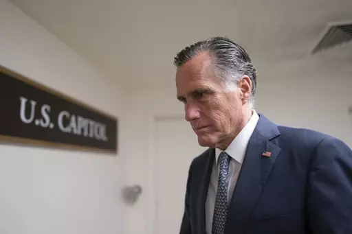 Sen. Mitt Romney, R-Utah, a member of the Senate Foreign Relations Committee, heads to a vote before a national security briefing on Ukraine, at the Capitol in Washington, March 16, 2022. Romney will not run for reelection in 2024. The former presidential candidate and Massachusetts governor announced his intentions in a video statement Wednesday. (AP Photo/J. Scott Applewhite, File)