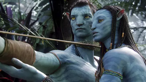 This image released by 20th Century Fox shows the characters Neytiri, right, and Jake in a scene from the 2009 movie "Avatar." The sequel, “Avatar: The Way of Water” may have finally arrived in theaters in 2022, but that long parade of “Avatar” delays isn’t done, yet. The Walt Disney Co. on Tuesday pushed the release of “Avatar 3” a year, bumping it from December 2024 to December 2025. (AP Photo/20th Century Fox, File)
