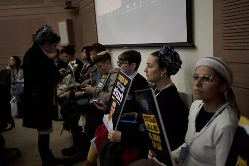 Relatives and supporters of Israelis held hostage by Hamas attend a committee hearing at the Knesset, Israel's parliament, in Jerusalem, Monday, Feb. 5, 2024. Across Israel, the chants of "Now! Now! Now!" ring out at nearly every protest imploring Israel's government to do everything possible to win the immediate release of dozens of hostages held by Hamas in Gaza. But a small group of families of hostages are pushing a different message: let the army first finish the job of defeating the milita