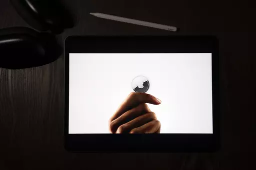 FILE -In this illustration photographed in La Habra, Calif., the AirTag tracking device is introduced during a virtual event held to announce new Apple products, Tuesday, April 20, 2021. Apple and Google on Tuesday, May 2, 2023, disclosed they are teaming up in an effort to thwart unwanted tracking on smartphones through Bluetooth devices designed to help people find their keys, keep tabs on their luggage and locate other things they don’t want to line. The two companies behind the iPhone and 