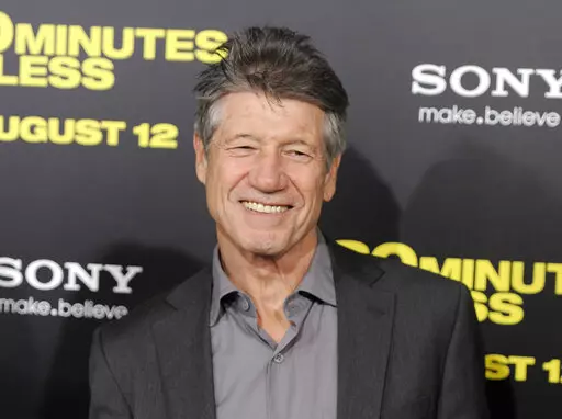 Fred Ward, a cast member in "30 Minutes or Less," poses at the premiere of the film in Los Angeles on Aug. 8, 2011. Ward, a veteran actor who brought a gruff tenderness to tough-guy roles in such films as “The Right Stuff,” “The Player” and “Tremors,” died Sunday, May 8, his publicist Ron Hofmann said Friday, May 13, 2022. He was 79. (AP Photo/Chris Pizzello, File)
