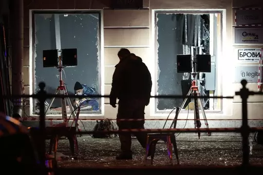 Russian investigators work at the site of an explosion at a cafe in St. Petersburg, Russia, Sunday, April 2, 2023. An explosion tore through a cafe in the Russian city of St. Petersburg on Sunday, and preliminary reports suggested a prominent military blogger was killed and more than a dozen people were injured. (AP Photo)