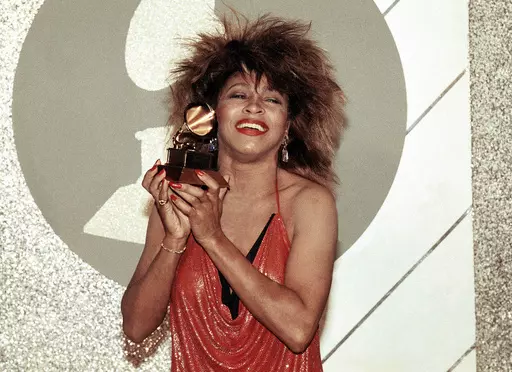 Tina Turner, Pop and R&B vocalist, as holds up a Grammy Award, Feb. 27, 1985, in Los Angeles. Turner, the unstoppable singer and stage performer, died Wednesday, after a long illness at her home in Küsnacht near Zurich, Switzerland, according to her manager. She was 83 (AP Photo/Nick Ut, File)