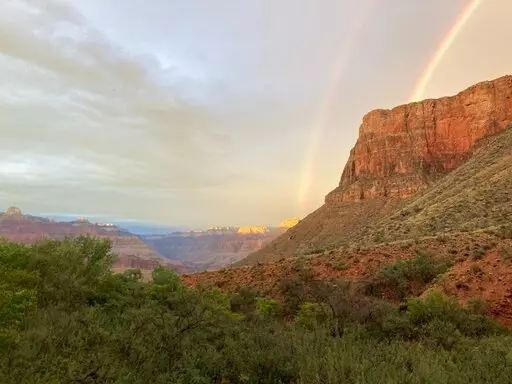 This August 2022 photo provided by the National Park Service shows a double rainbow from the ranger station porch at Indian Garden, which is now called Havasupai Gardens, in Grand Canyon National Park. The Indian Garden name assigned to a popular Grand Canyon campground has been changed out of respect for a Native American tribe that was displaced by the national park. The Havasupai Tribe and Grand Canyon National Park announced Monday, Nov. 21, that Indian Garden will be renamed Havasupai Garde