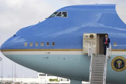 President Donald Trump arrives on Air Force One at Miami International Airport, Thursday, April 3, 2025, in Miami. (AP Photo/Rebecca Blackwell)