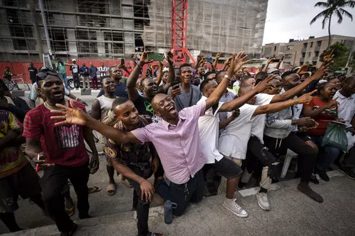 Party agents and supporters of presidential candidate Peter Obi of the Labour Party cheer as their candidate wins the count at a polling station near to the home of ruling party presidential candidate Bola Tinubu, in Lagos, Nigeria Saturday, Feb. 25, 2023. Voters in Africa's most populous nation are heading to the polls Saturday to choose a new president, following the second and final term of incumbent Muhammadu Buhari. (AP Photo/Ben Curtis)