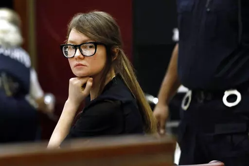 FILE — Anna Sorokin sits at the defense table during jury deliberations in her trial at New York State Supreme Court, April 25, 2019, in New York. Sorokin, whose exploits inspired a Netflix series, has been released from immigration custody into home confinement, a spokesperson said Saturday, Oct. 8, 2022.  (AP Photo/Richard Drew, File)