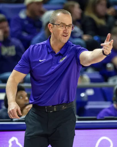James Madison head coach Sean O'Regan directs his team during the first half of a women's NCAA college basketball game against North Carolina in Harrisonburg, Va., Sunday, Nov. 20, 2022. James Madison’s winter sports teams have picked up right where the fall programs finished in their transition to the Sun Belt Conference.(Daniel Lin/Daily News-Record via AP, File)