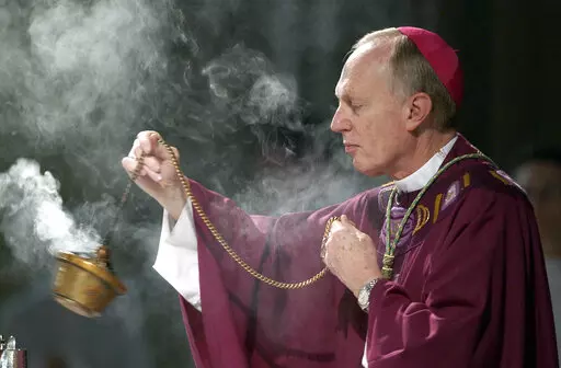 Bishop Howard Hubbard swings incense during an Ash Wednesday communion service at the Cathedral of the Immaculate Conception on Feb. 25, 2004, in Albany, N.Y. Hubbard, now retired and who has admitted to covering up for predator priests and has himself been accused of sexual abuse, has asked Pope Francis to laicize him, or remove him from the priesthood. Hubbard, 84, announced the decision in a statement Friday, Nov. 18, 2022, the day the United Nations has designated as the World Day for Previo