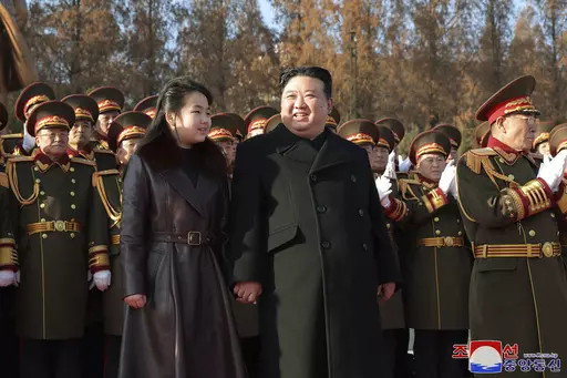 In this photo provided by the North Korean government, its leader Kim Jong Un and his daughter visit the defense ministry for events to celebrate the 76th founding anniversary of the country's army in North Korea, Thursday, Feb. 8, 2024. Independent journalists were not given access to cover the event depicted in this image distributed by the North Korean government. The content of this image is as provided and cannot be independently verified. Korean language watermark on image as provided by s