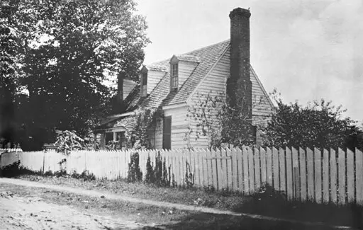 FILE- This early 1900s photo provided by the The Colonial Williamsburg Foundation shows the front of the Dudley Digges House in its original location on Prince George Street, in Williamsburg, Va. The Andrew W. Mellon Foundation has given a $5-million boost to efforts to preserve the colonial-era schoolhouse where enslaved and free Black children were taught in Virginia, officials announced Friday, Feb. 18, 2022.   (Courtesy of John D. Rockefeller Jr. Library/The Colonial Williamsburg Foundation