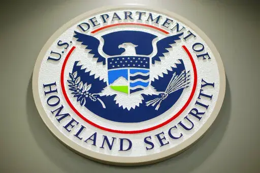 The Department of Homeland Security logo is seen during a news conference in Washington, Feb. 25, 2015. DHS says a looming Supreme Court decision on abortion, an increase of migrants at the U.S.-Mexico border and the midterm elections are potential triggers for extremist violence over the next six months. DHS said June 7, 2022, in the National Terrorism Advisory System bulletin the U.S. was in a "heightened threat environment" already and these factors may worsen the situation. (AP Photo/Pablo M