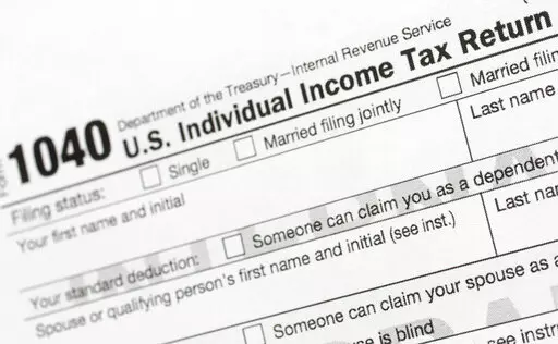 A portion of the 1040 U.S. Individual Income Tax Return form is shown July 24, 2018, in New York. The IRS said Tuesday, June 21, 2022, that it will have erased its backlog of last season's tax returns by the end of this week. (AP Photo/Mark Lennihan, File)